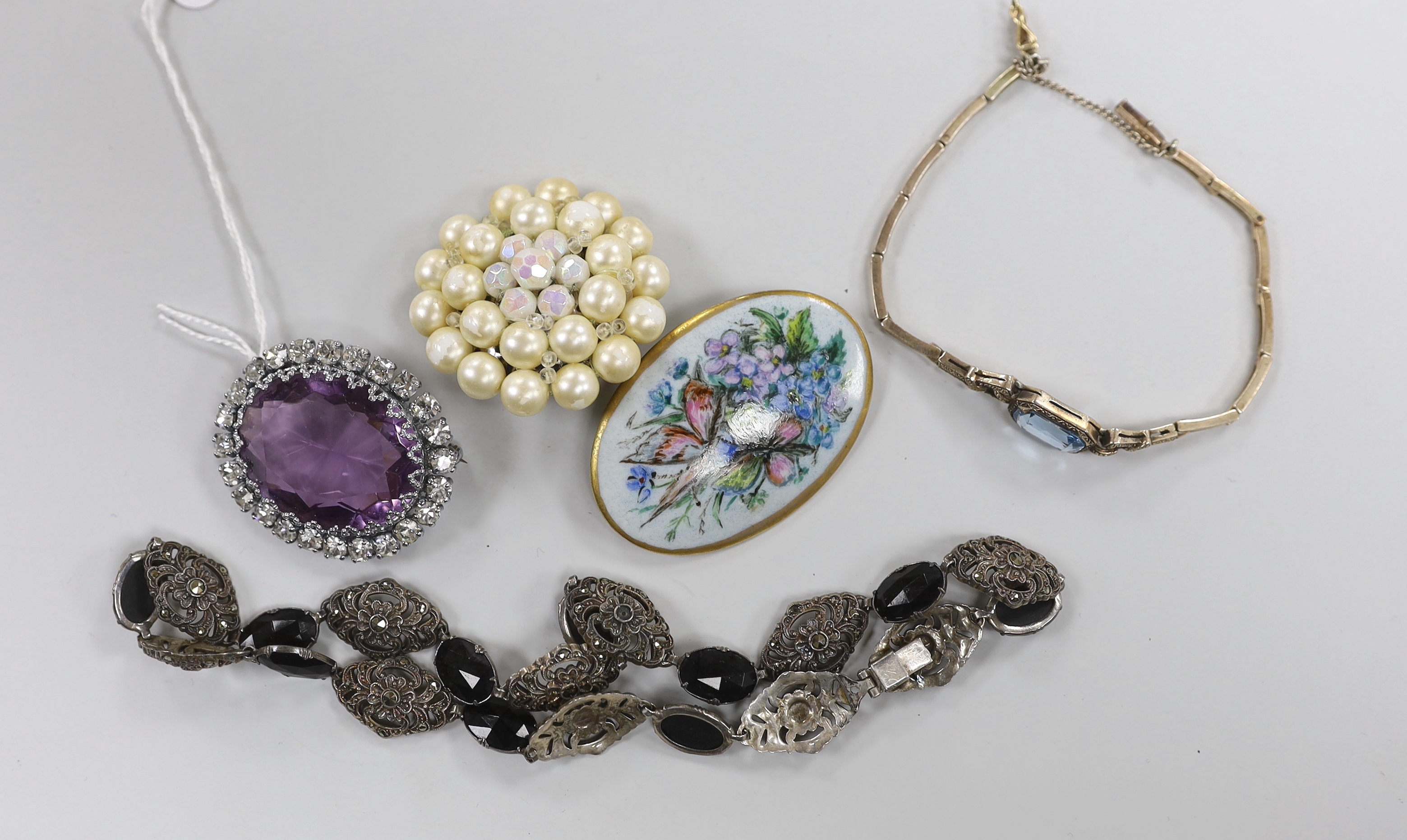 A small group of assorted costume jewellery including marcasite necklace, amethyst paste brooch, bracelet etc.